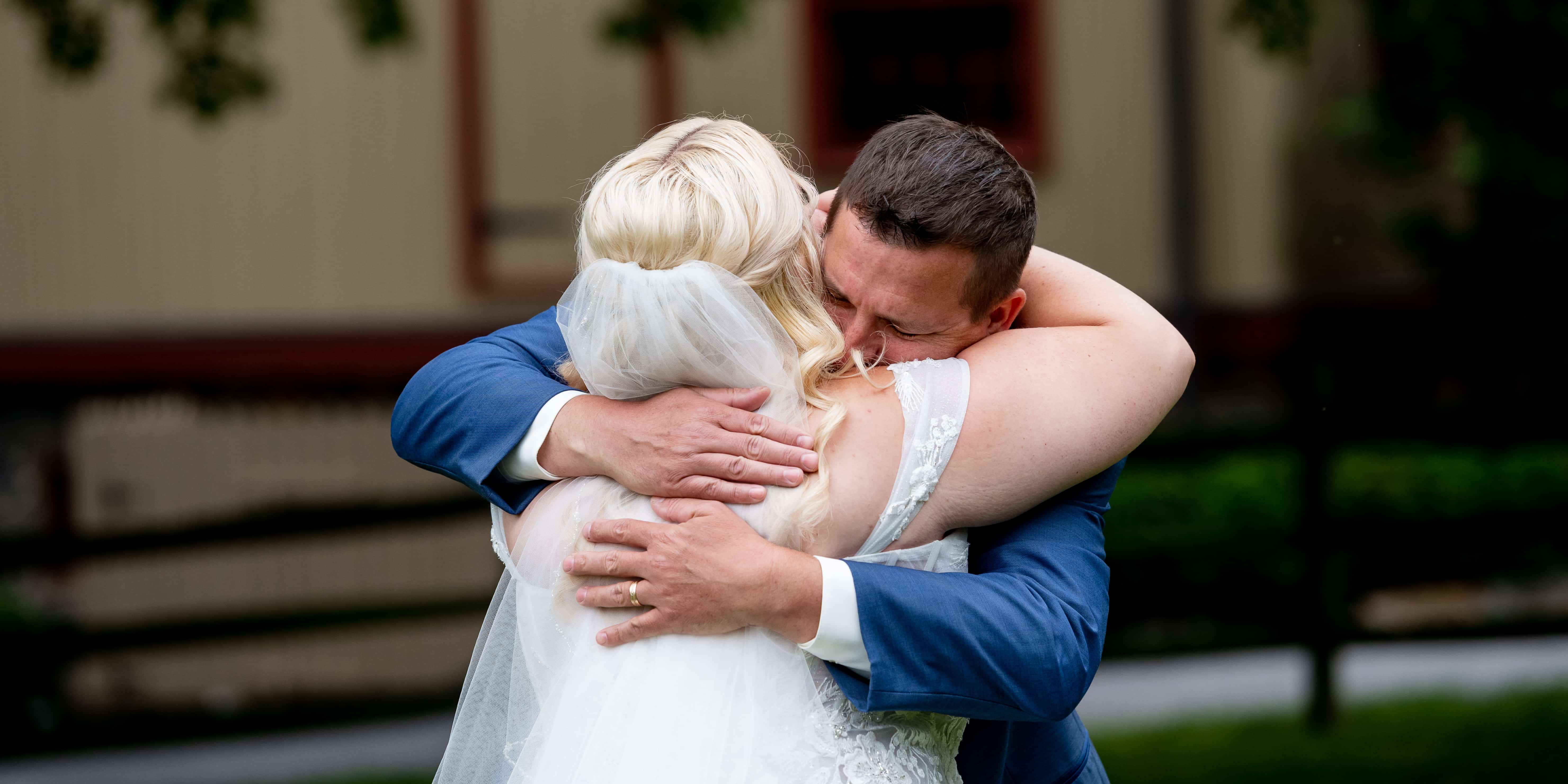 bride and dad hugging