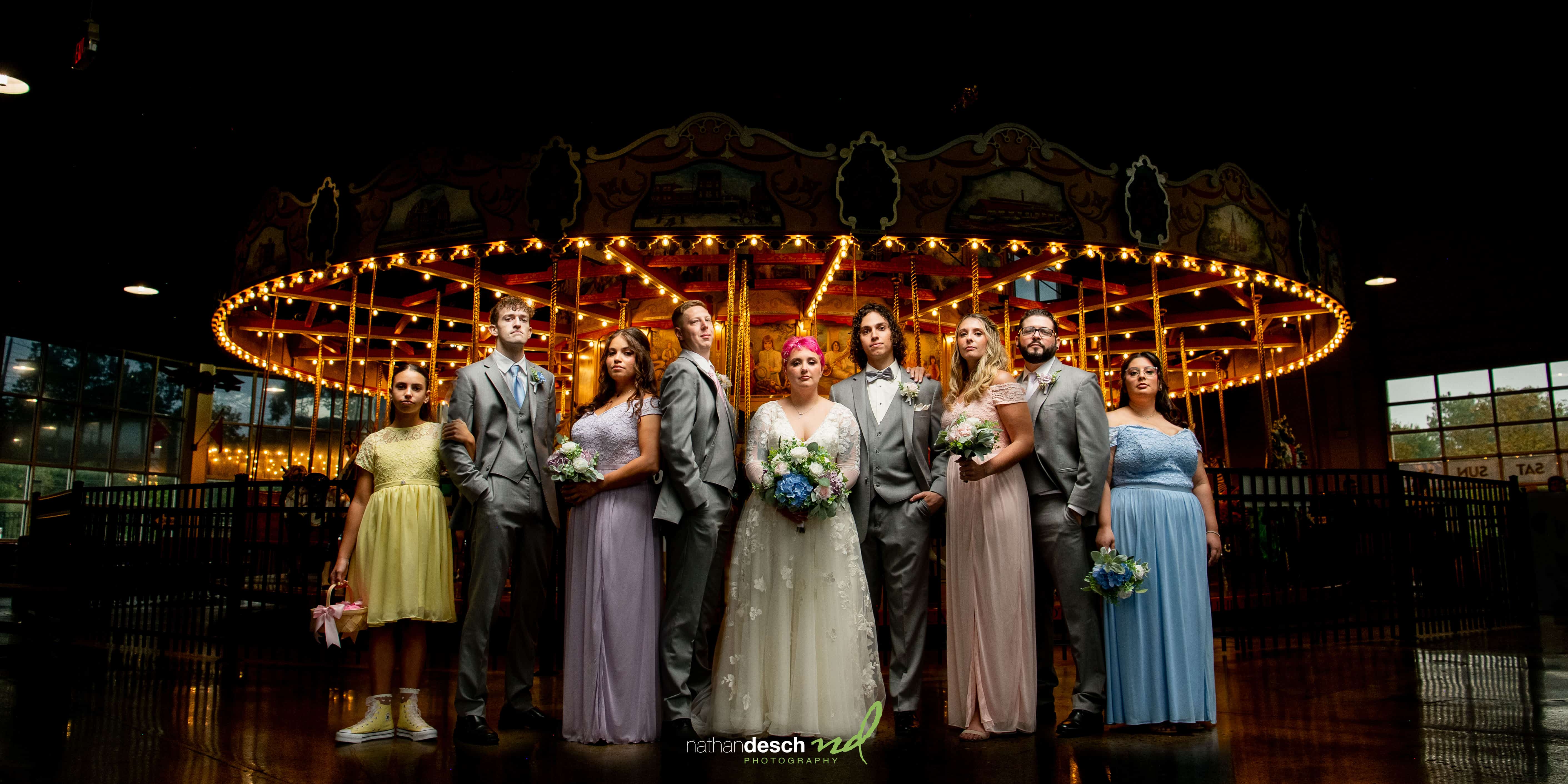 wedding party by carousel