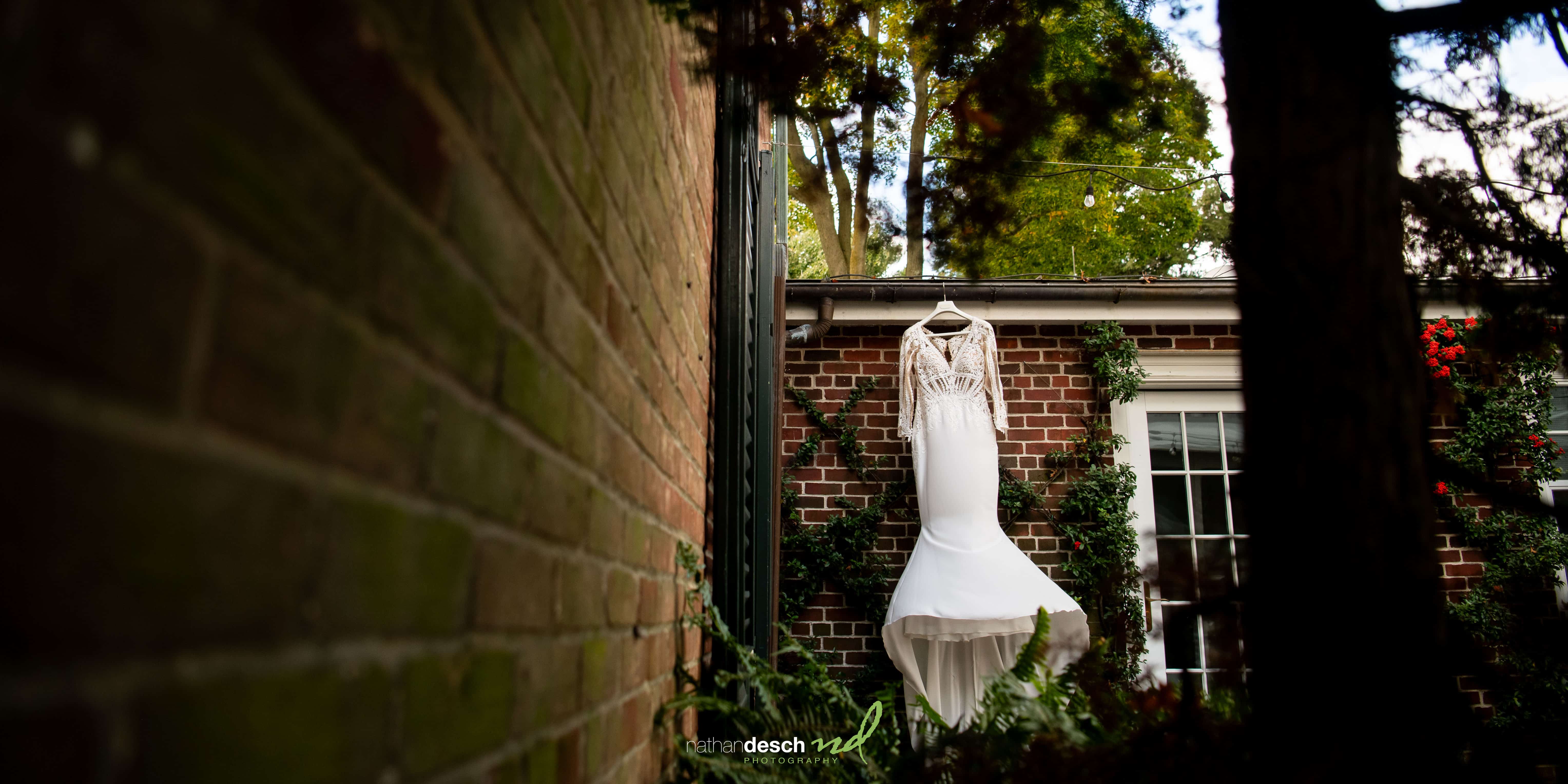 brides dress hanging outside