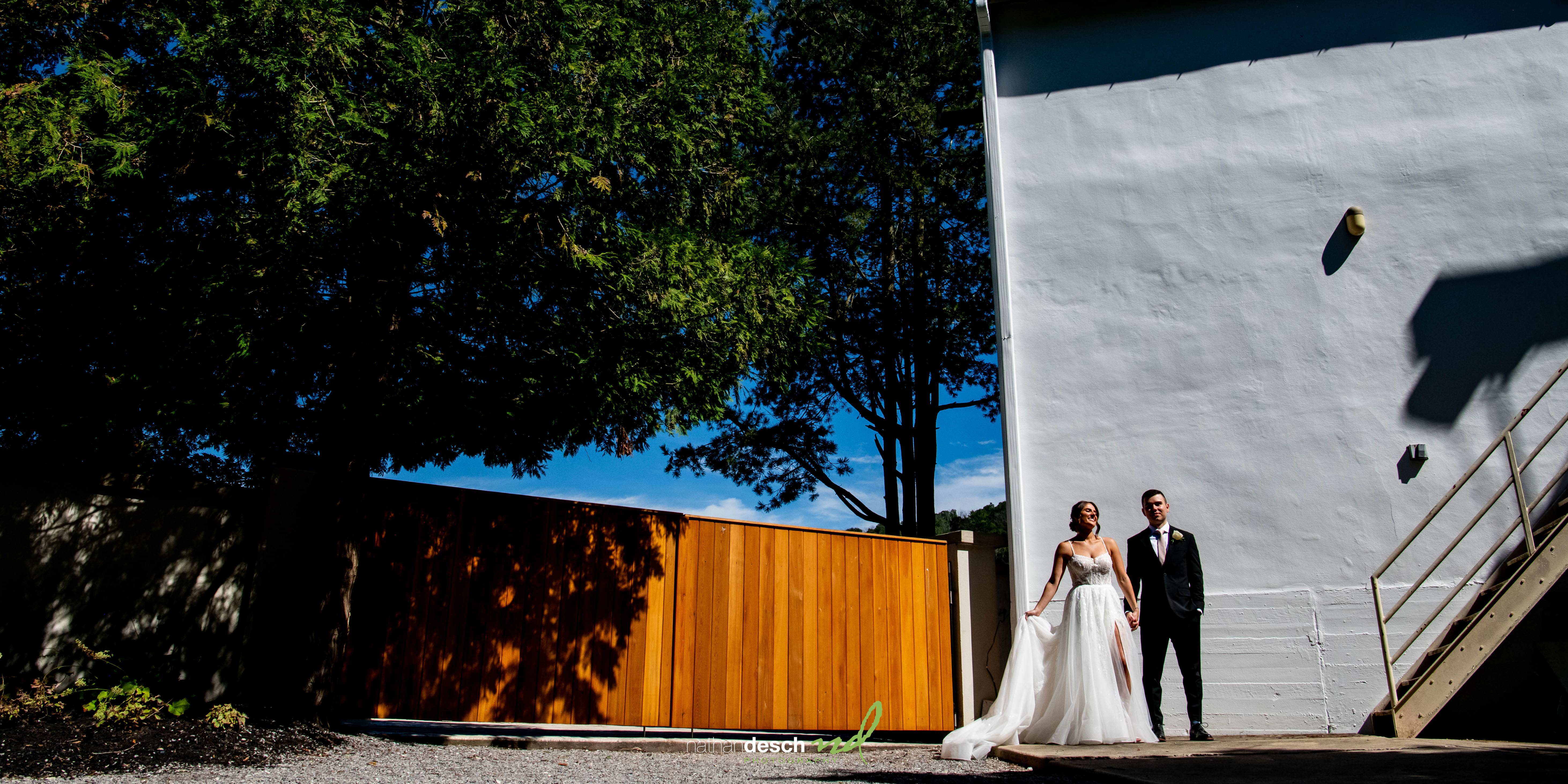 Bride and groom portraits at the river house at odettes