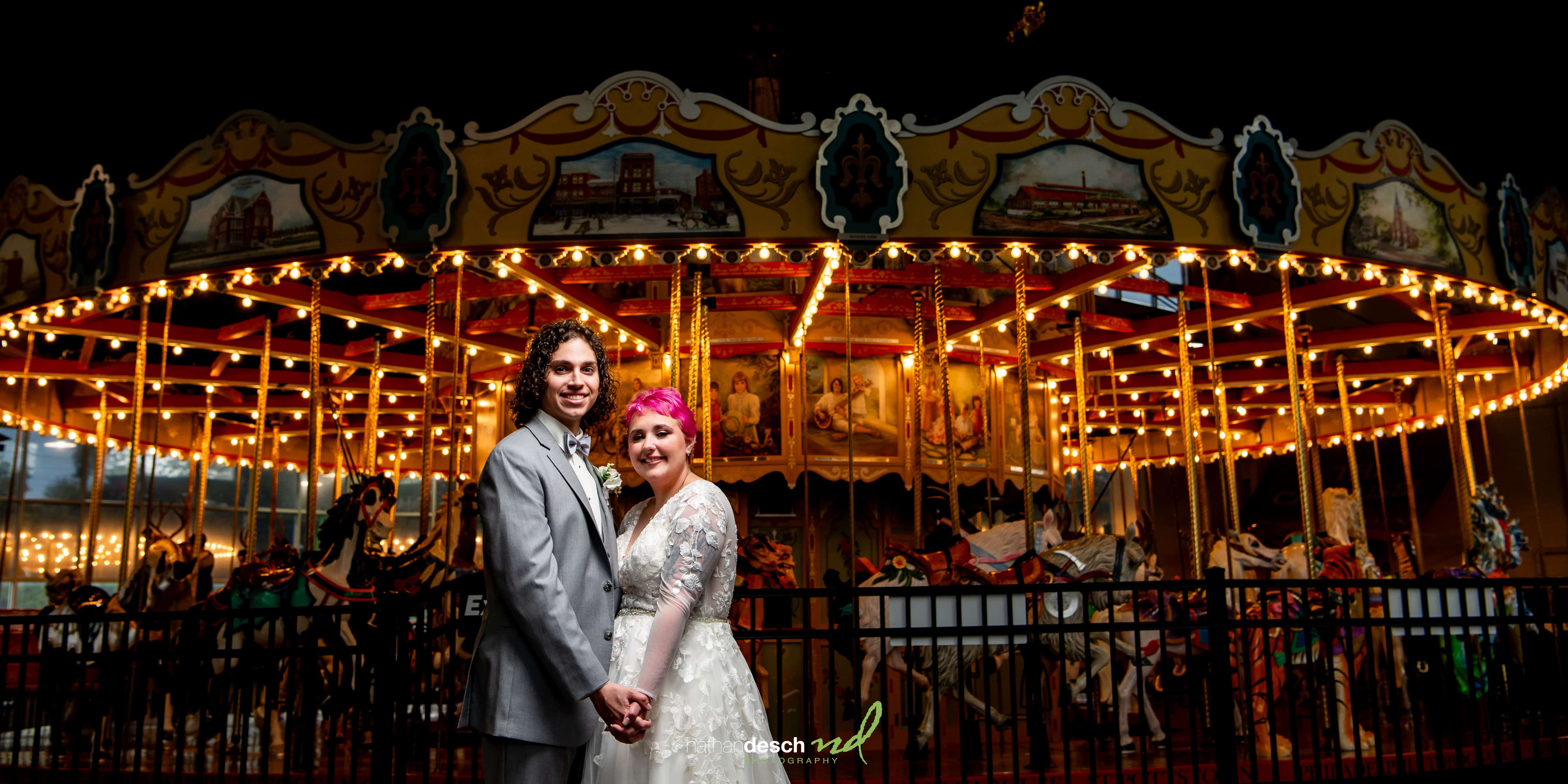 Bride and groom at carousel 