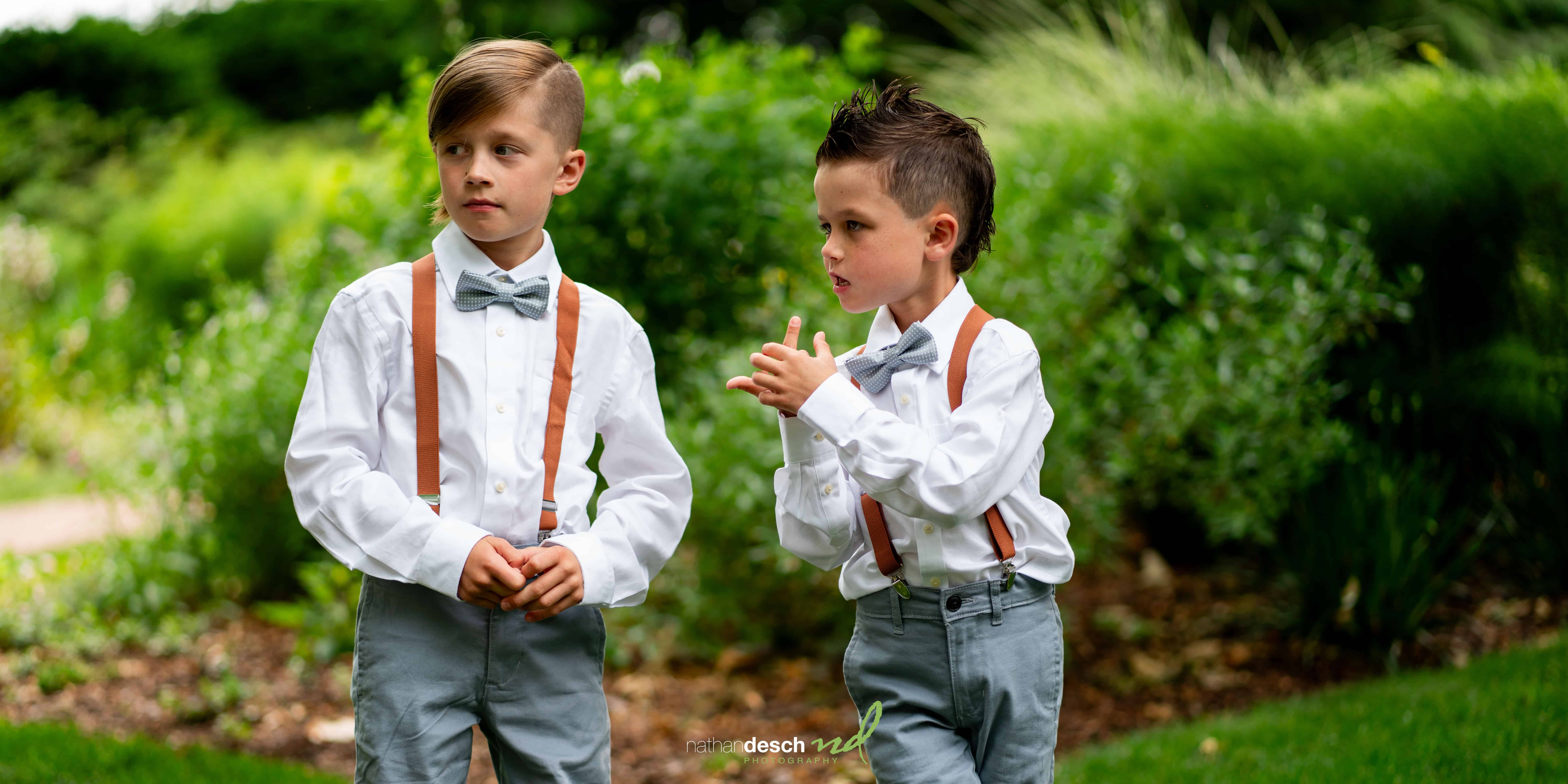 little boy giving the middle finger at wedding