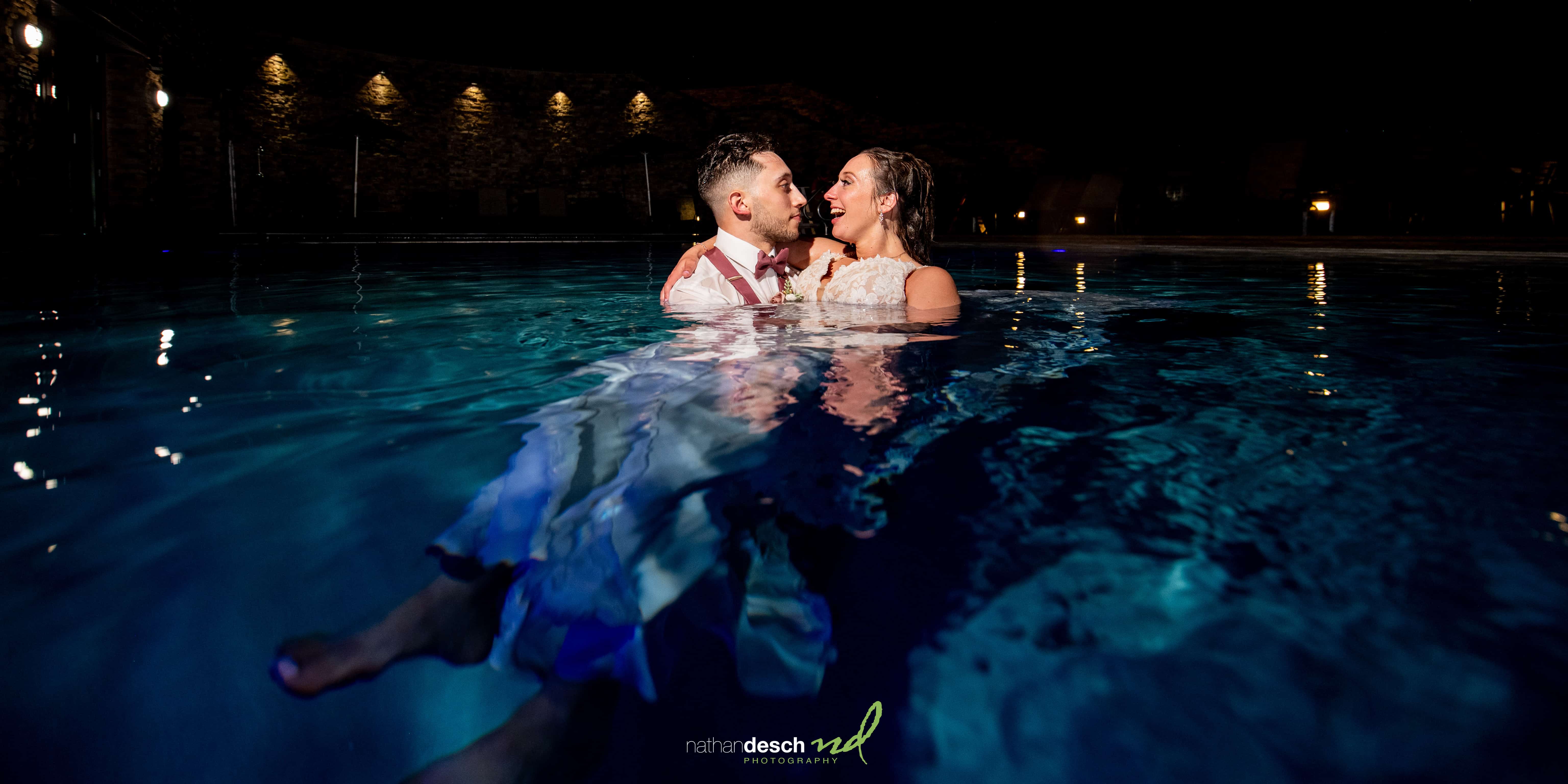 portraits of bride and groom in pool at bear creek