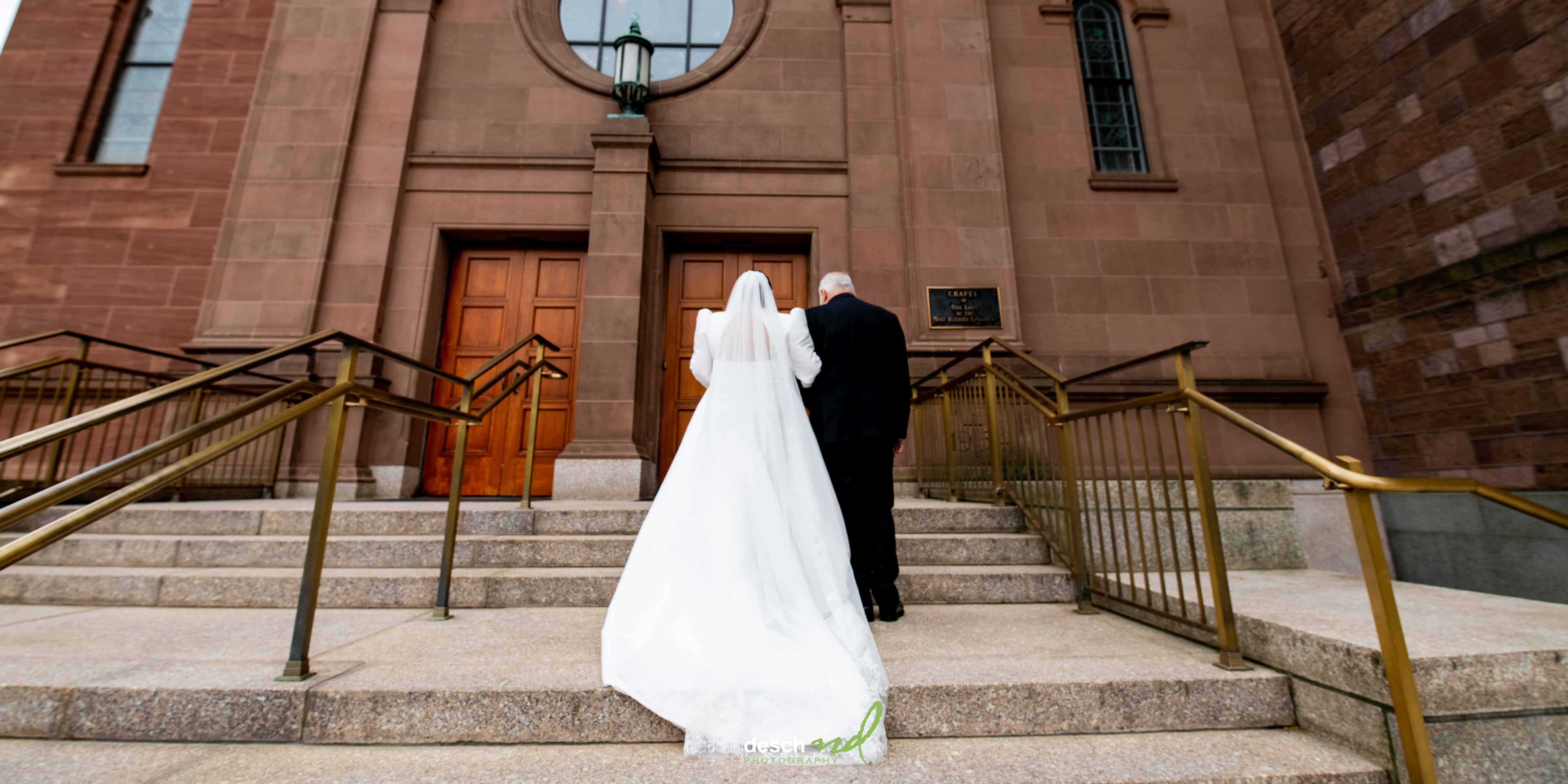 bride and her father entering Cathedral Basilica of Saints Peter and Paul