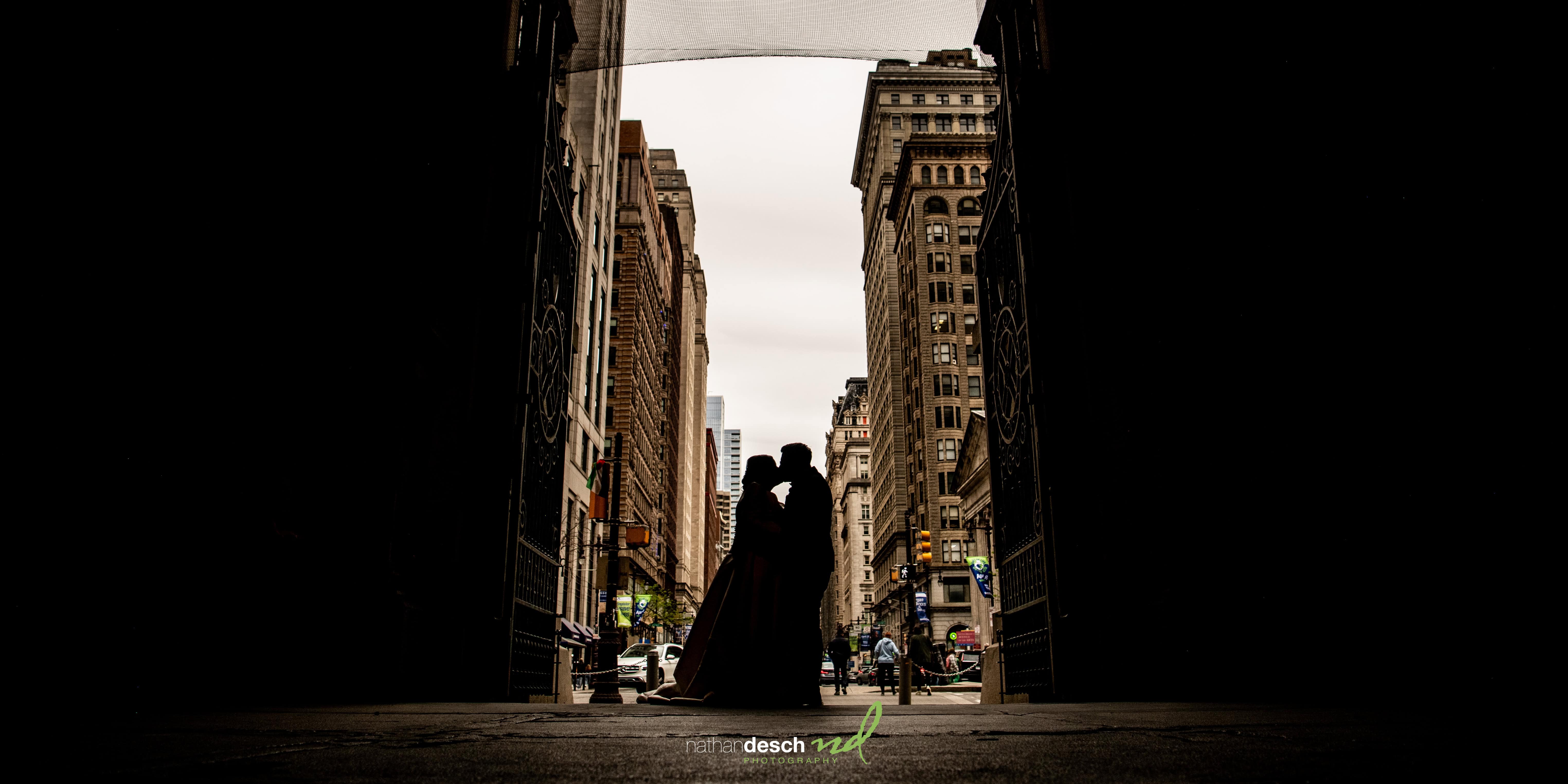 silhouette of couple at city hall in philadelphia