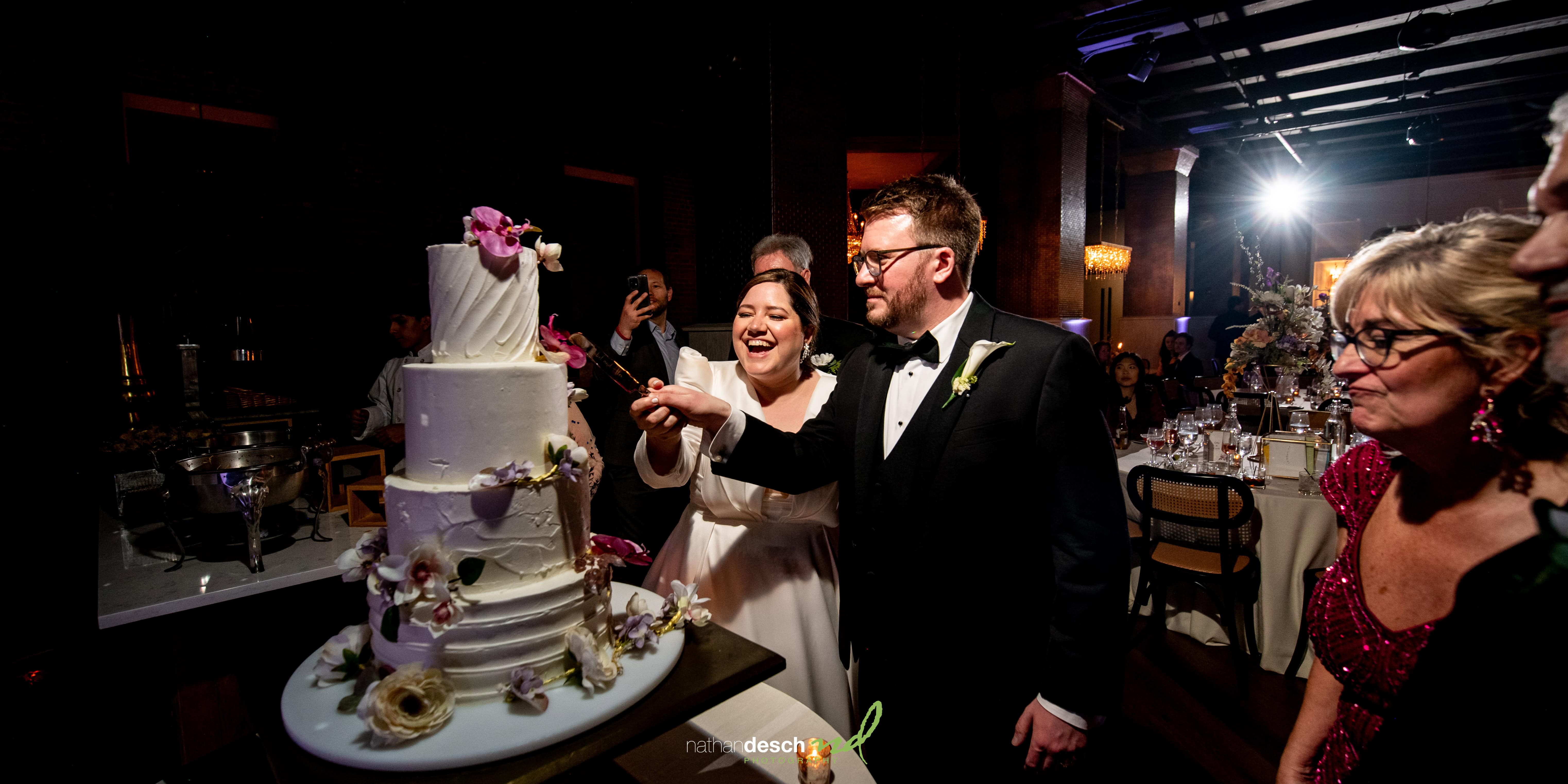 Bride and groom cutting the cake