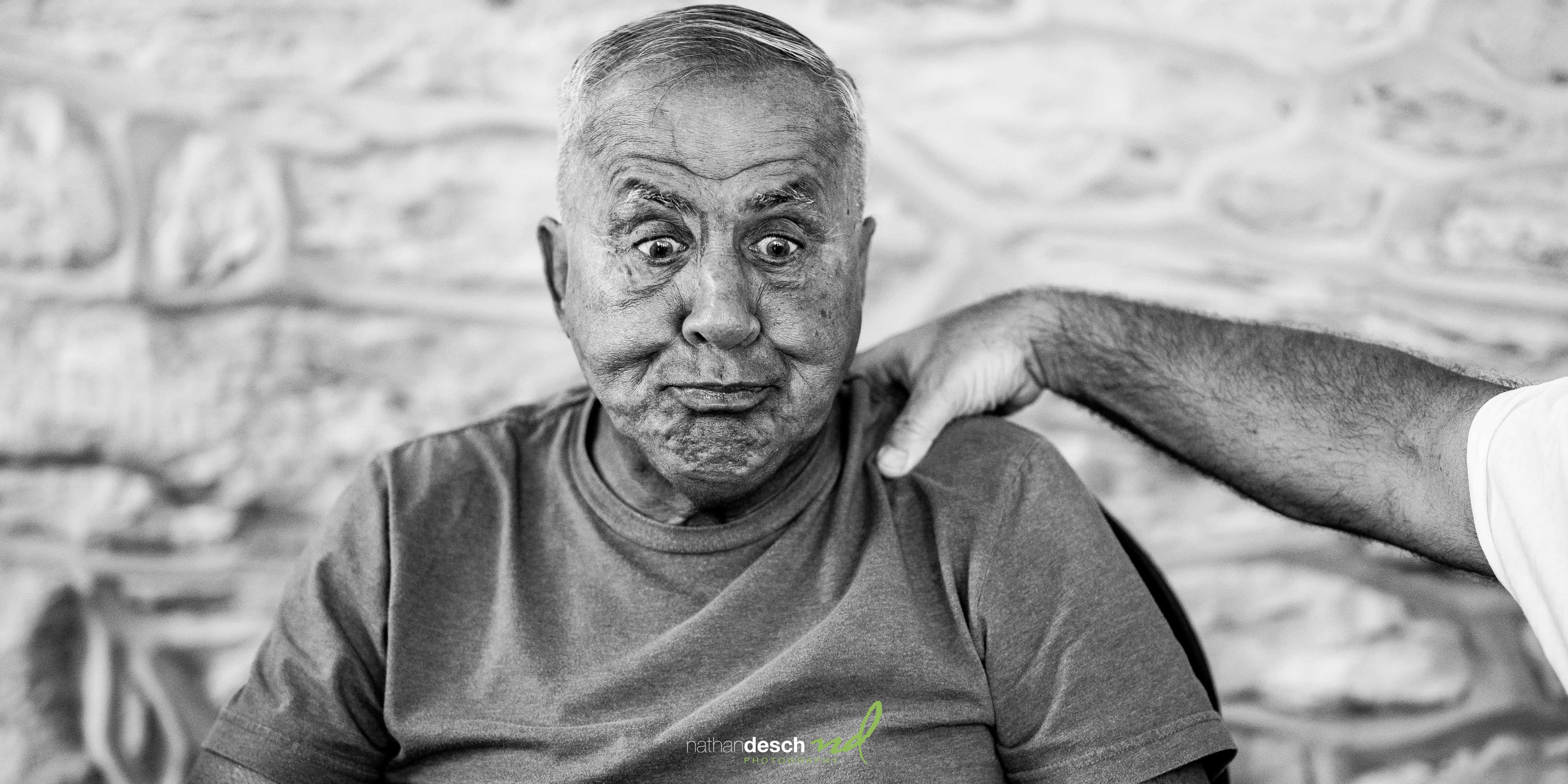 Grandfather making funny face after a shot