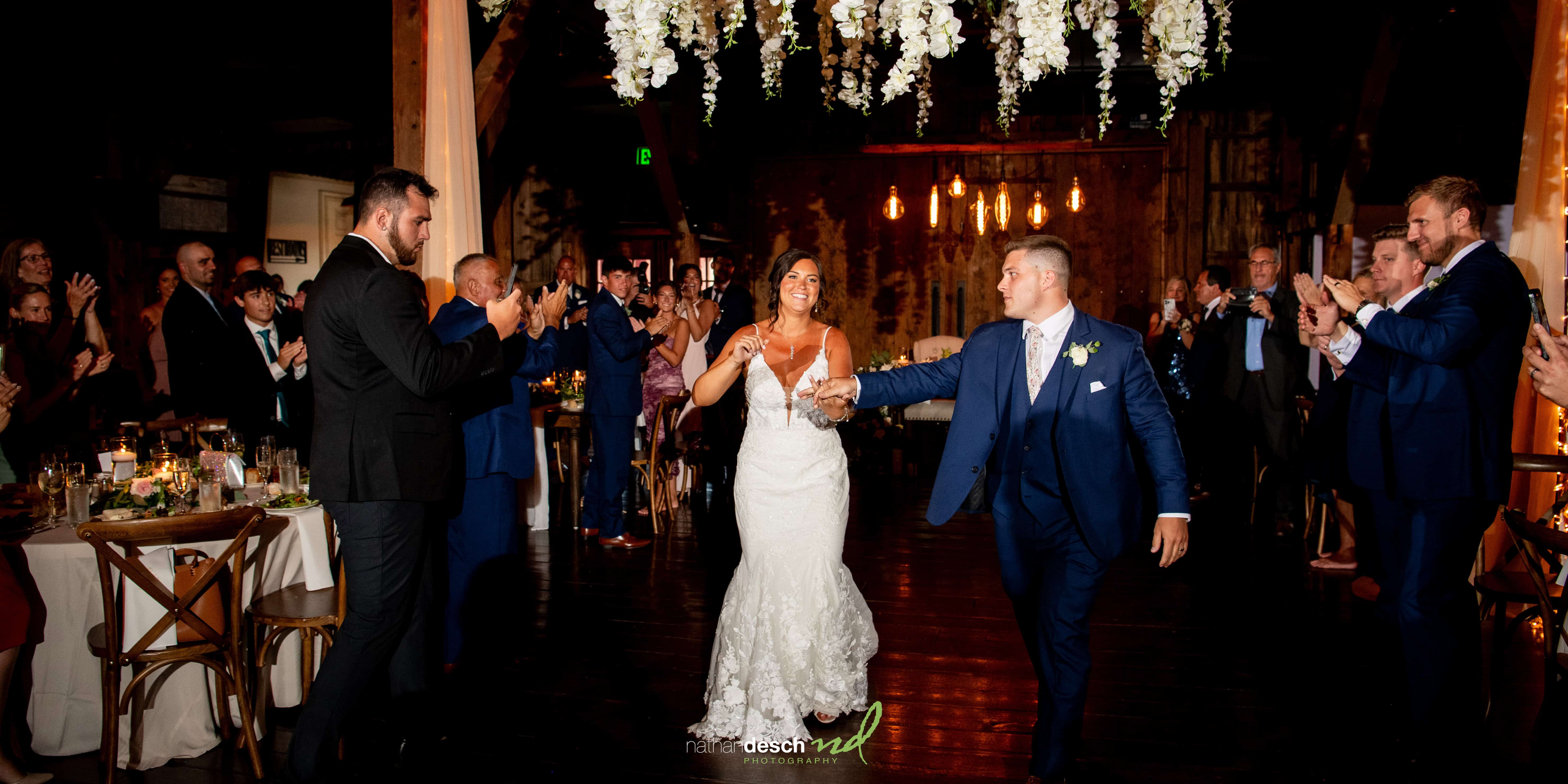 Bride and groom make entrance into reception at the farm at eagles ridge