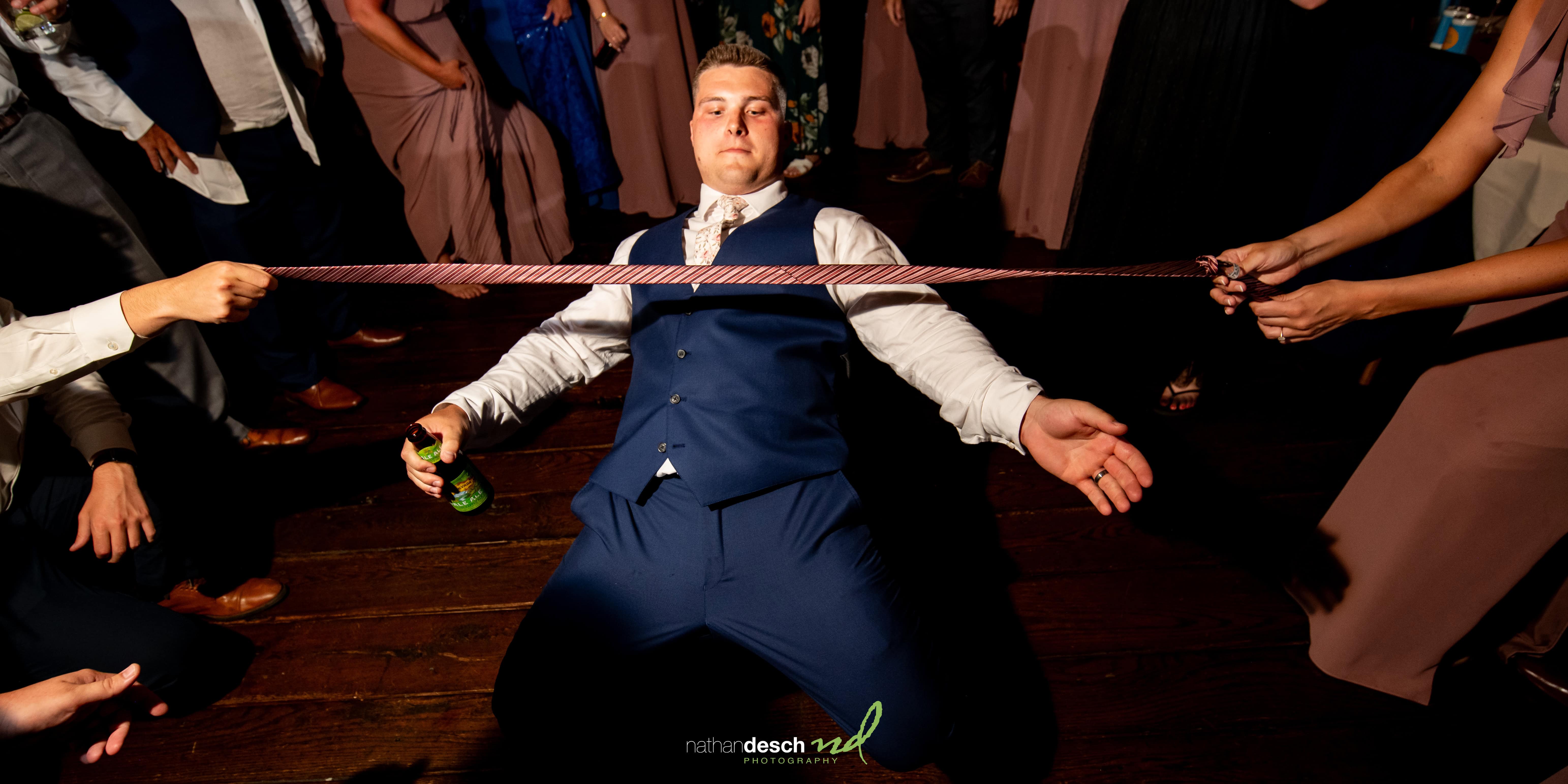 groom doing limbo