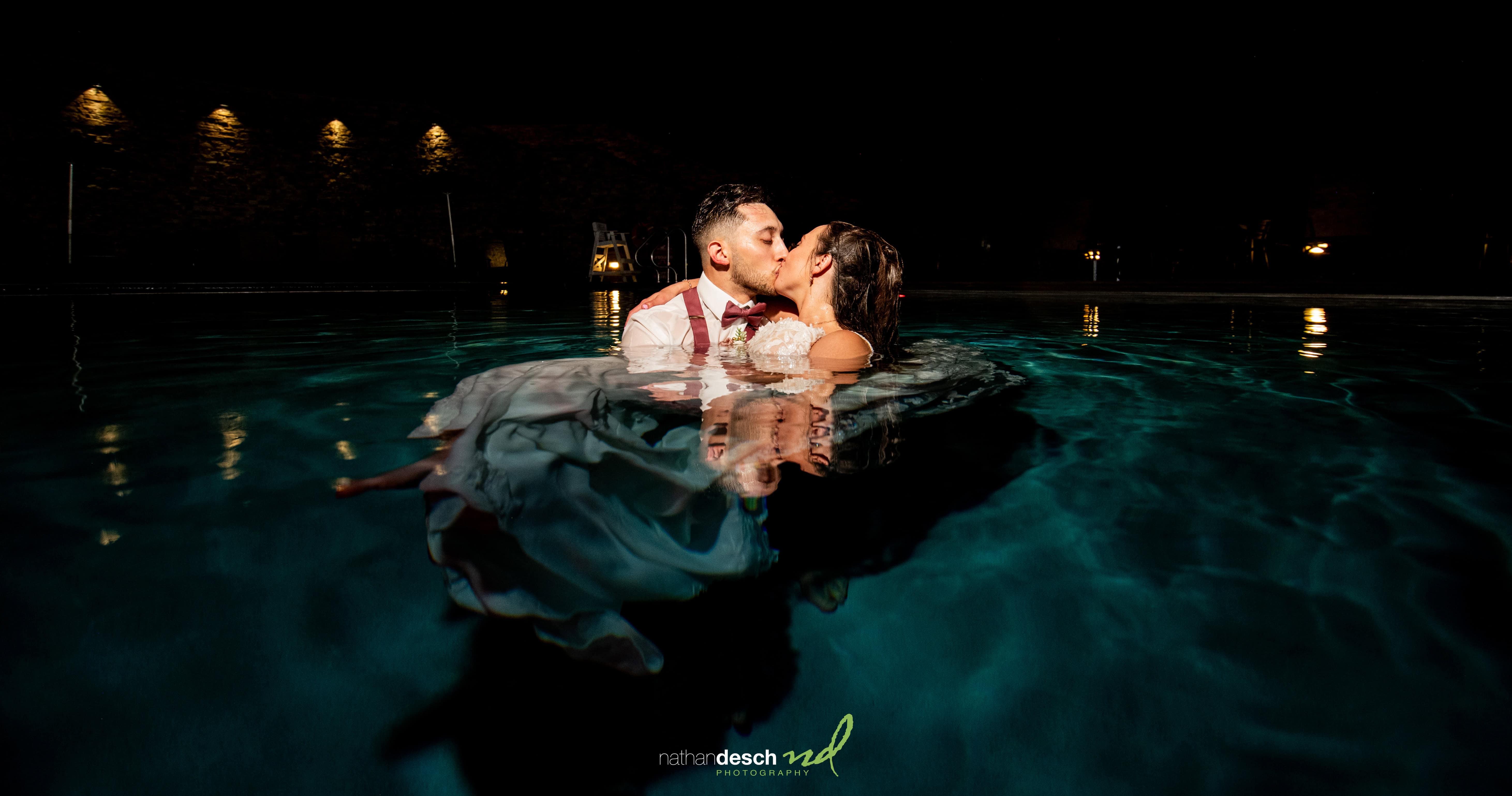 Bride and groom in pool at bear creek