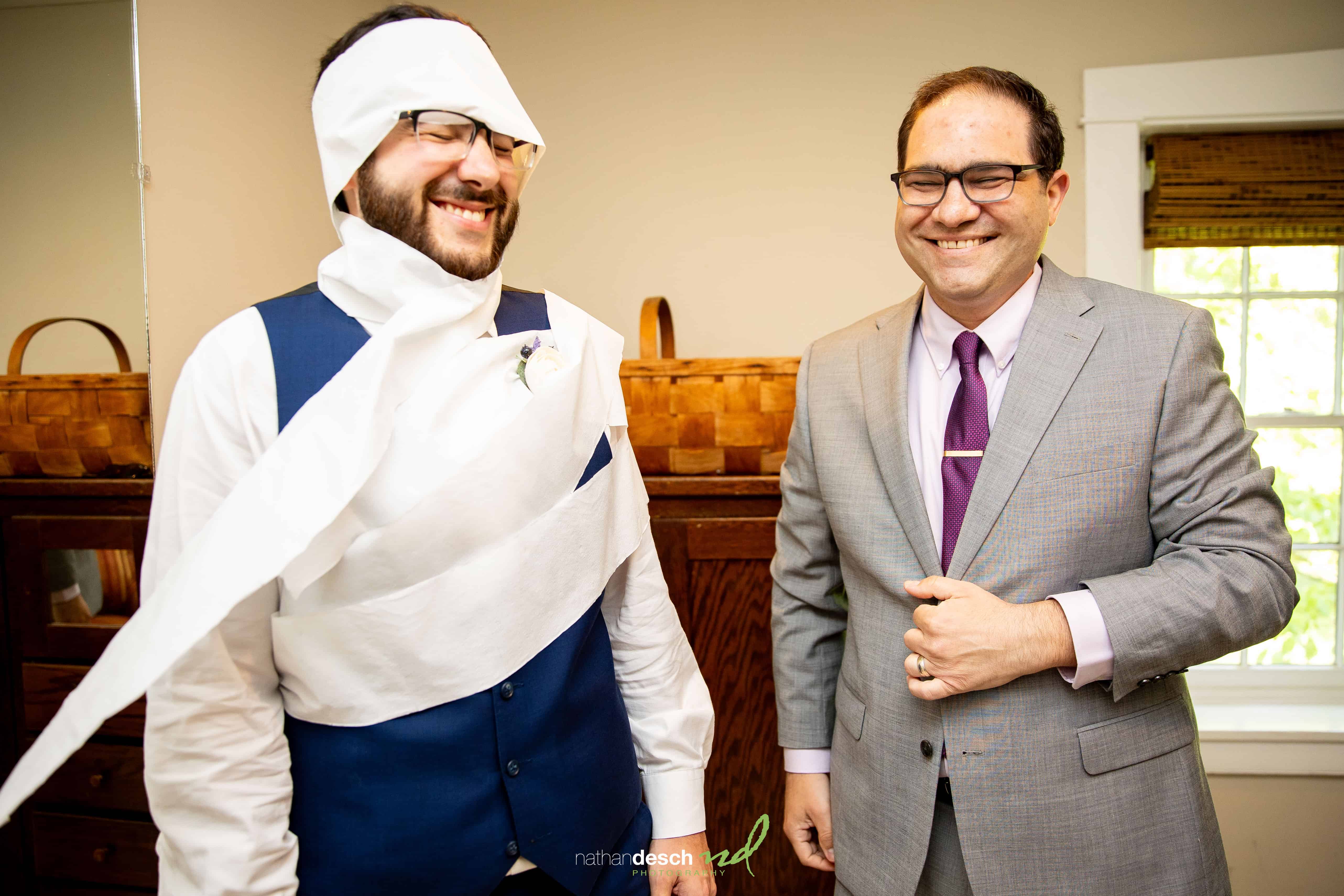 groom wrapped in toilet paper